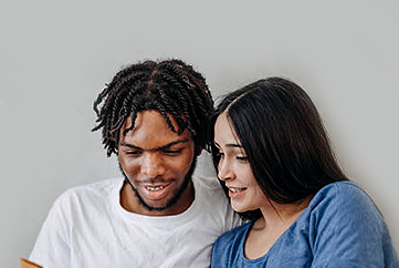 Two adults looking at a book