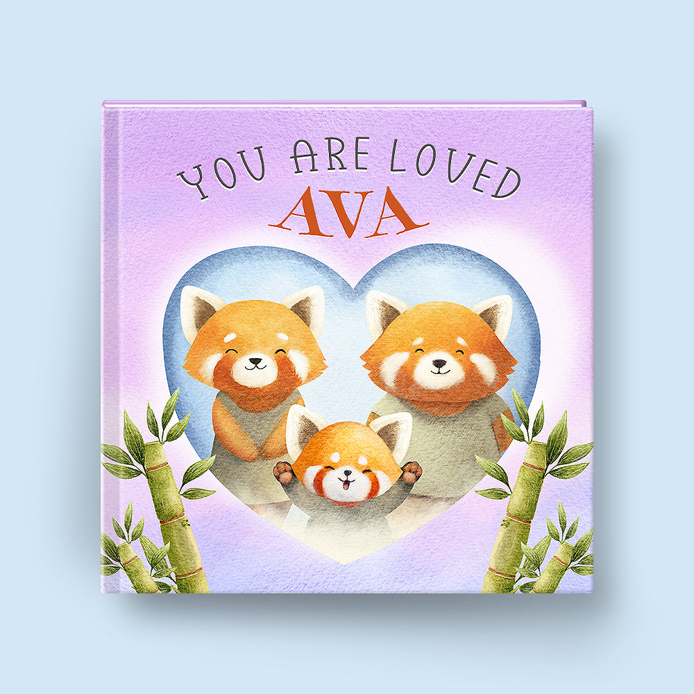 Children's book with red panda illustration and 'You are loved Ava' text on a light blue background