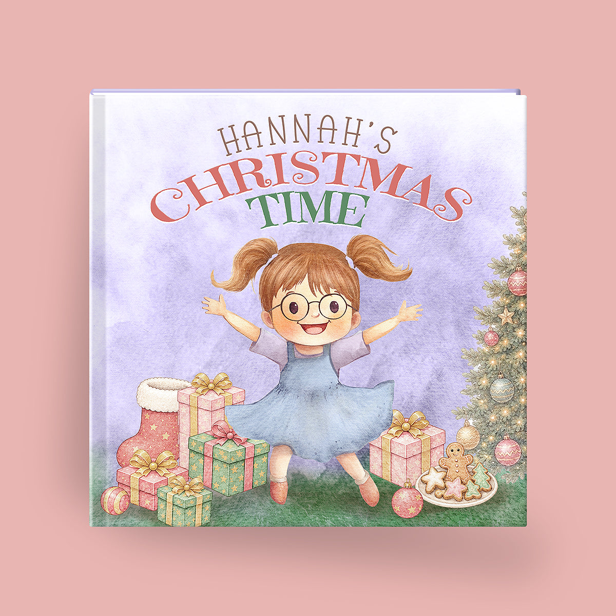 A personalized children's picture book titled 'HANNAH'S CHRISTMAS TIME' shown against a solid pink background. The cover features a watercolor illustration of a girl with glasses and pigtails in a blue dress, surrounded by Christmas presents, stockings, and a decorated tree.